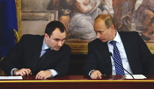 Vladimir Putin (R) talks with Boris Kovalchuk / Photo by REUTERS/Alessandro Garofalo